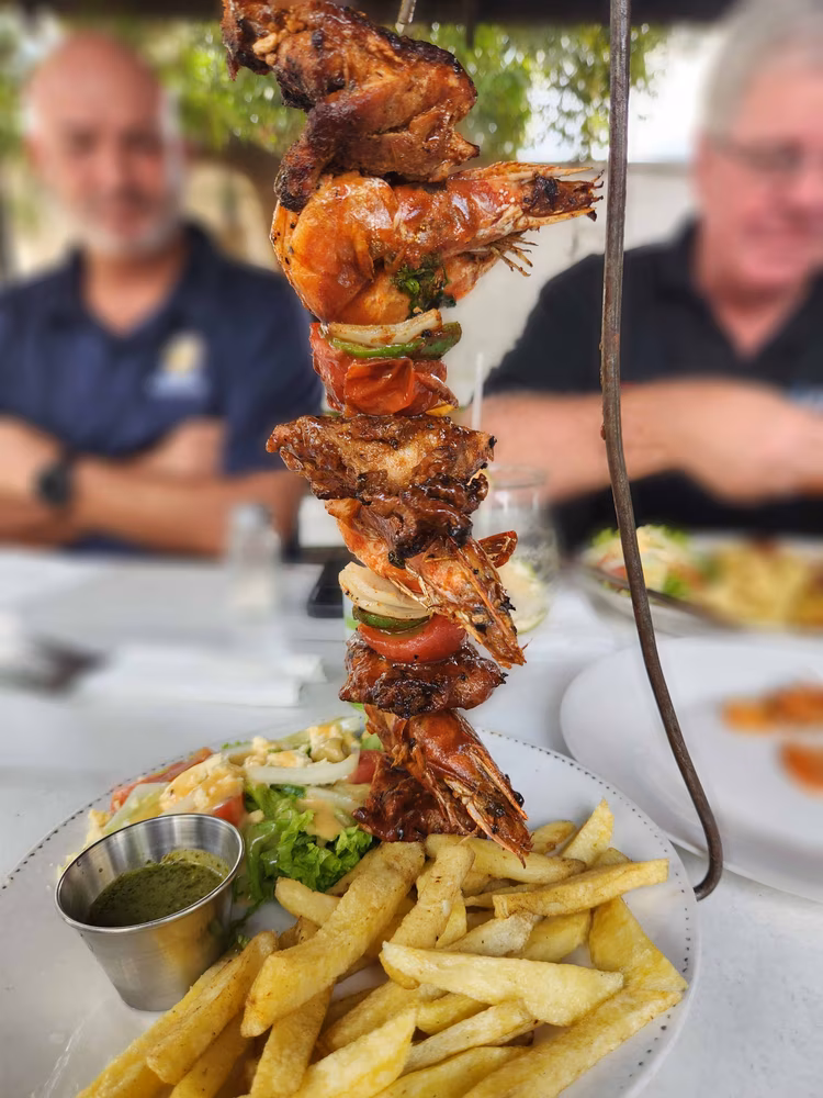 The aroma of their signature Portuguese-Brazilian-style skewers fill the air. (Image courtesy of Zest Bar and Restaurant ).