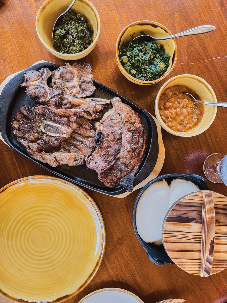 Mpoto Yathu is a restaurant inspired by traditional Zambian cuisine. Try their michopo mbuzi (roasted goat meat) with nshima and traditional veggies for a real treat. (Image courtesy of Bongani B Kumar).