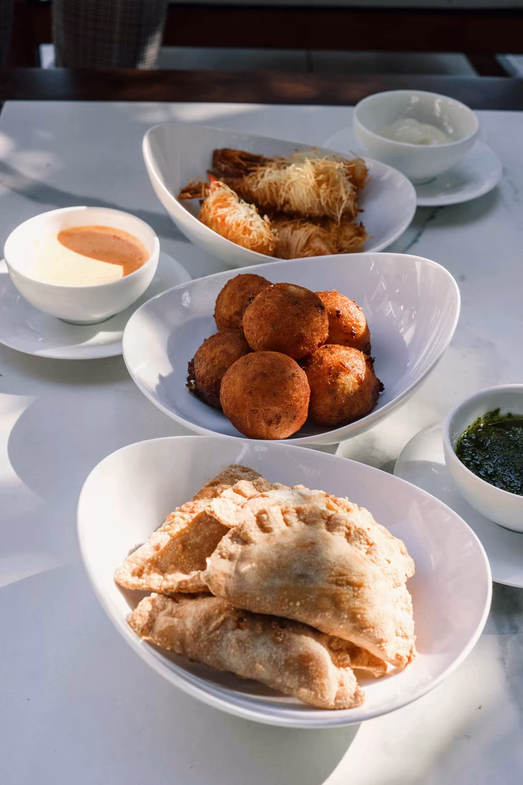 Encountering a vetkoek at a fine dining experience was surprisingly delightful, undoubtedly embodying the restaurant's ethos of elevating the African dining experience. (Image courtesy of The Saxon Hotel, Villas, Spa).