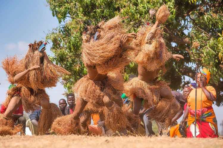 Beneath the spectacle of elaborate Nyau masks—including the towering Makanja on stilts and the restless Gulugufe butterfly—lies a profound ceremony of governance. (Image by Ian Murphy)