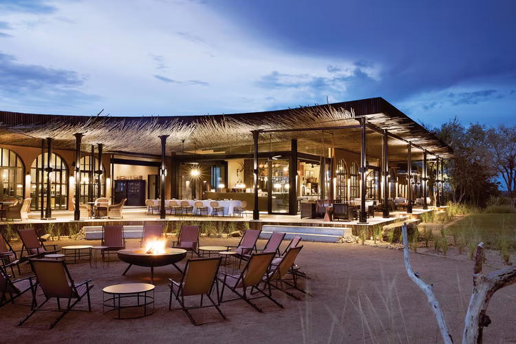 Spend relaxed evenings sipping your favourite blend around the boma fire, as your guides regale you with stories and legends of the bush. (Image courtesy of Elsa Young).